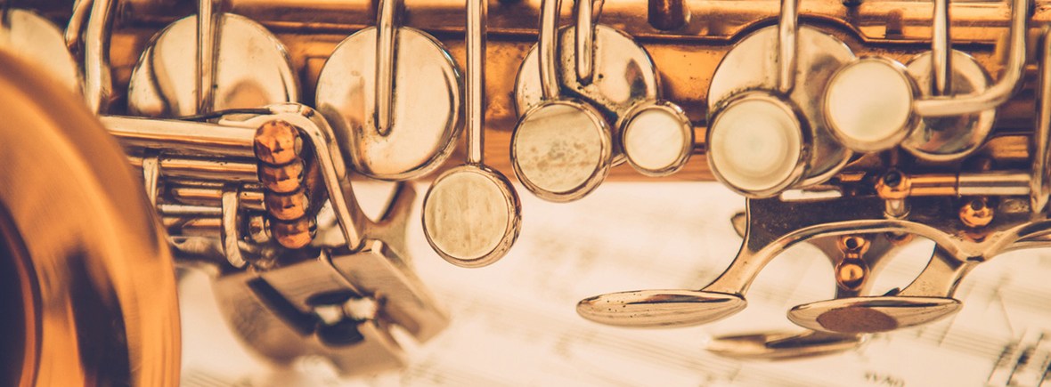 Close-up of Alto Saxophone on Music Sheet